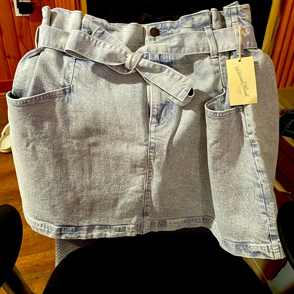 Light wash, paper bag style skirt is perfect to dress up or down!